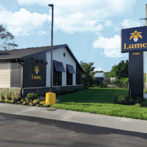 Lume Cannabis Co dispensary storefront in Grand Rapids Michigan with signature palm tree logo and modern exterior design